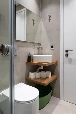 a bathroom with a sink and a toilet and a mirror at Filoxenia MG Projects-City Living Metro in Athens