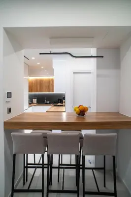 a kitchen with a large wooden table and chairs at Filoxenia MG Projects-City Living Metro in Athens