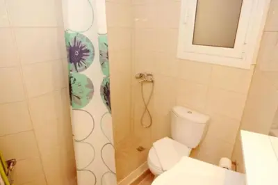 a small bathroom with a toilet and a shower at Lovely Studio With Amazing Terrace in Athens