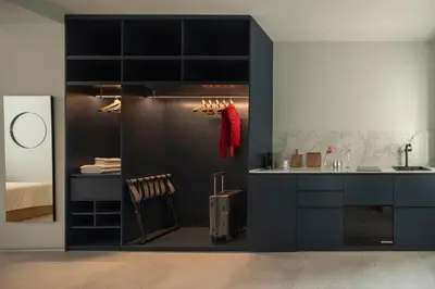 a kitchen with black cabinets and a sink at P28 Suite 105 in Athens