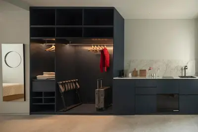 a kitchen with black cabinets and a sink at P28 Suite 106 in Athens
