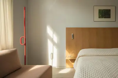 a bedroom with a bed and a chair in it at P28 Suite 106 in Athens