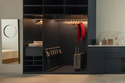 a room with a kitchen with a bed and a counter at P28 Suite 107 in Athens
