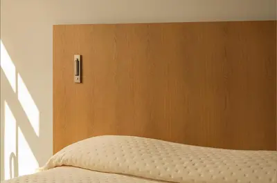 a bedroom with a wooden headboard and a bed at P28 Suite 107 in Athens