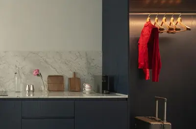 a kitchen with a counter with a red shirt on a rack at P28 Suite 107 in Athens