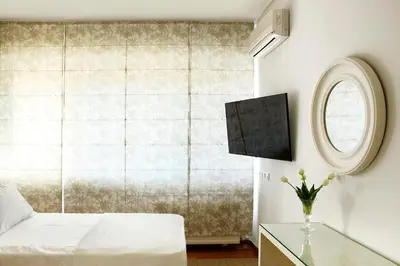 a bedroom with a bed and a window at Casa Taylor 4BR with private pool and sea view in Lagonissi