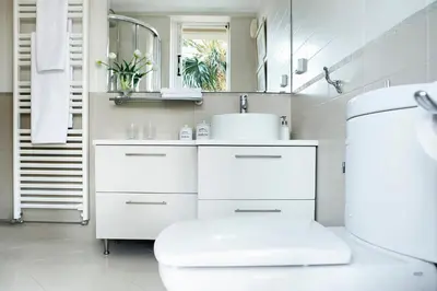 a white bathroom with a sink and a mirror at Casa Taylor 4BR with private pool and sea view in Lagonissi