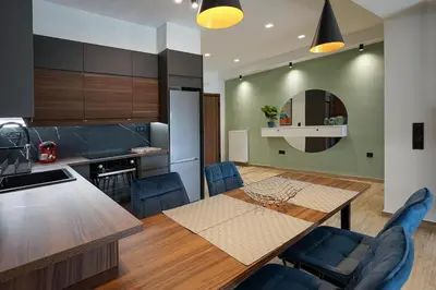 a kitchen and dining room with a table and chairs at Polis luxury apartment 2 in Athens