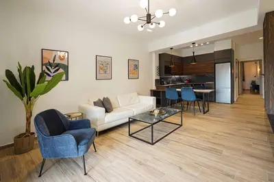 a living room with a couch and chairs and a table at Polis luxury apartment 2 in Athens
