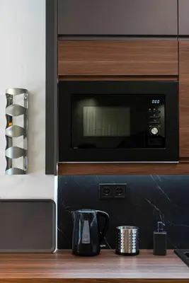 a microwave oven in a kitchen with a coffee pot at Polis luxury apartment 2 in Athens