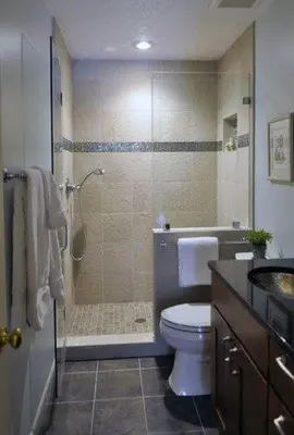 a bathroom with a shower and a toilet and a sink at Acharnon home in Athens