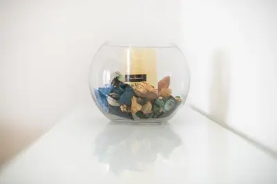 a glass vase filled with rocks and other items at Ble Elia Monastiraki Suite in Athens