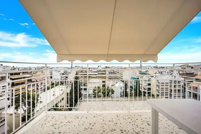 a balcony with a view of a city at Athens sky & Acropolis view rooftop apartment! in Athens