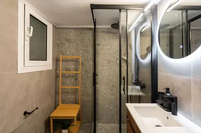 a bathroom with a sink and a shower at 1BR Modern & Cozy Apt Near Metro and Acropolis in Athens