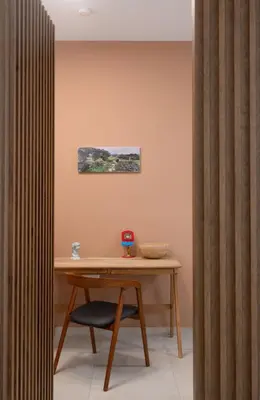 a wooden desk with a chair in a room at 2BR Luxurious Apt in Mets 20 min From Acropolis in Athens
