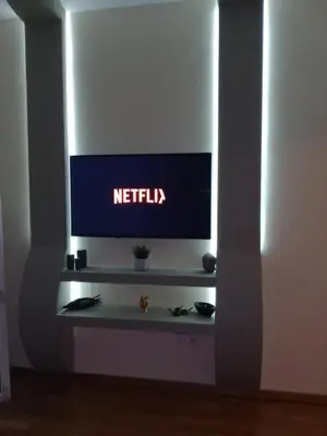a television with a netflix sign on a wall at SOKRATESg in Athens