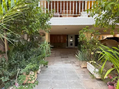 an empty hallway in a building with plants at Cute Detached Home near Glyfada Center in Athens