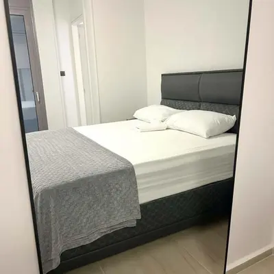 a mirror reflection of a bed in a bedroom at The Perch Kolonaki Square Studio Prime Location in Athens