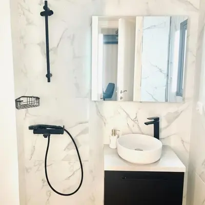 a bathroom with a shower and a sink at The Perch Kolonaki Square Studio Prime Location in Athens