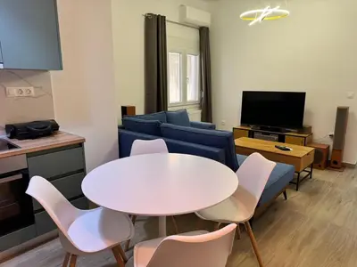 a living room with a white table and chairs at A&C Urban Elegance in Athens
