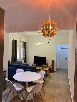 a living room with a table and a couch at A&C Urban Elegance in Athens