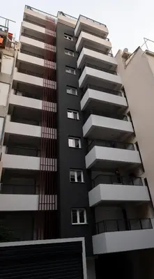 a black apartment building with balconies at Elvita Apartments 5 in Athens