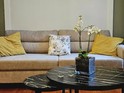 a living room with a couch and a coffee table at Leon Filoxenia in Athens