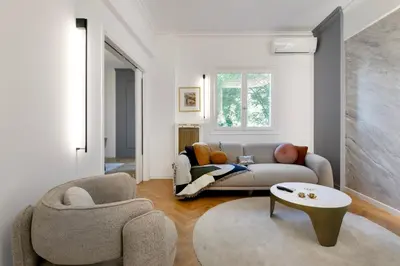 a living room with a couch and a table at Elysia - Crafted 2-Bedroom Apt & Balcony in Athens in Athens