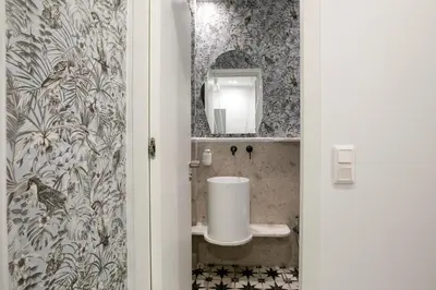 a bathroom with a sink and a mirror at Elysia - Crafted 2-Bedroom Apt & Balcony in Athens in Athens