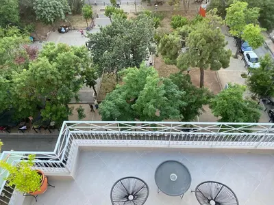 an overhead view of a balcony with a white railing at In the heart of Athens overlooking Kalligas Square! in Athens