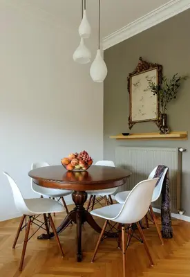 a dining room table with chairs and a bowl of fruit on it at Athens Anasses Luxury Apartments in Athens
