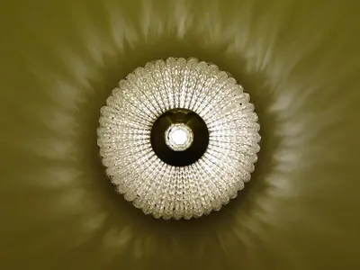 a chandelier hanging from the ceiling of a room at Athens Anasses Luxury Apartments in Athens