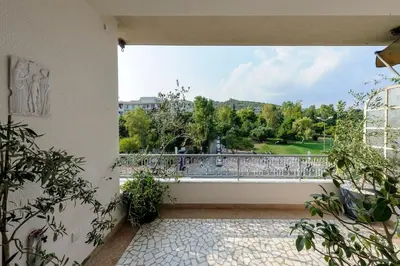 an empty balcony with a view of a park at Athens Anasses Luxury Apartments in Athens