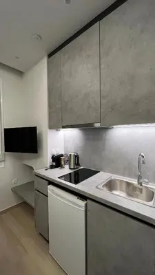 a kitchen with a sink and a counter top at ERIFILI -mini apartment in Athens