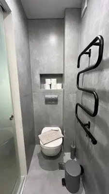 a small bathroom with a toilet and a shower at ERIFILI -mini apartment in Athens