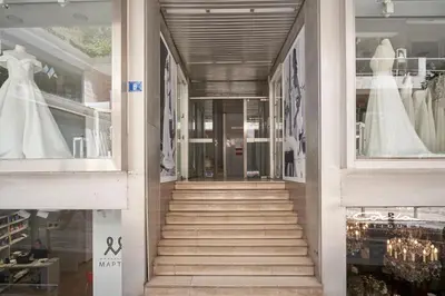 a staircase in a store with a wedding dress in a window at Charitos Luxury Hideaway 2bd Apt in Kolonaki in Athens