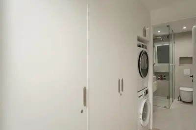 a white bathroom with a toilet and a sink at Metro Acropolis, 117sqm luxury 3BDR, SuperViewAthens in Athens