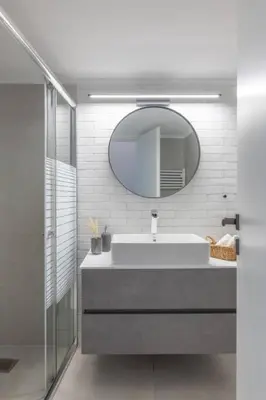 a bathroom with a sink and a mirror at Family-Friendly Thisseio Retreat Near Acropolis in Athens