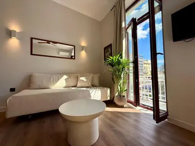 a living room with a couch and a table at Mosaics Agora Boutique Hotel in Athens