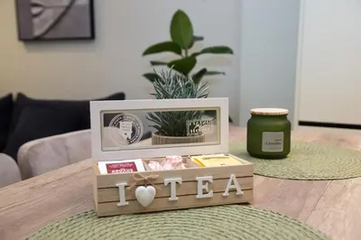 a wooden box with the word i tea on a table at Luxury apartments near athens city center in Athens