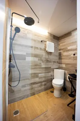 a bathroom with a toilet and a shower at Piraeus Harbor Hideaway in Piraeus