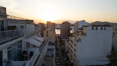 an aerial view of a city at sunset at Piraeus Harbor Hideaway in Piraeus