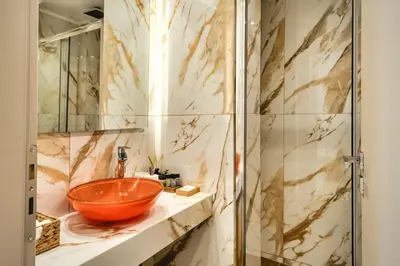 a bathroom with a bowl sink and a shower at Artemis House Athens in Athens