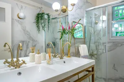 a bathroom with a white sink and a shower at Urban Νest in Athens next to Caravel in Athens