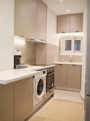 a kitchen with a washer and a dishwasher at Real Athens K17 in Athens