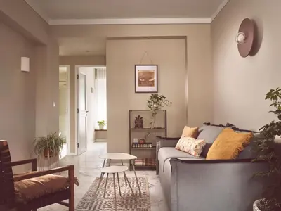 a living room with a couch and a table at Melpomeni House in Athens