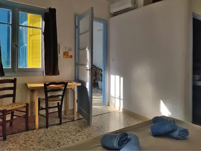 a room with a table and a table and a door at Back to the 50's near metro by Traser in Athens