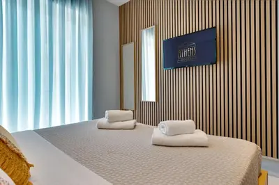 a bedroom with two white towels on a bed at Spacious Modern 3BD Apartment in Athens