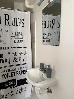 a bathroom with a sink and a mirror at Escape at Chalandri Athens in Athens