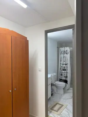 a bathroom with a toilet and a mirror at Escape at Chalandri Athens in Athens